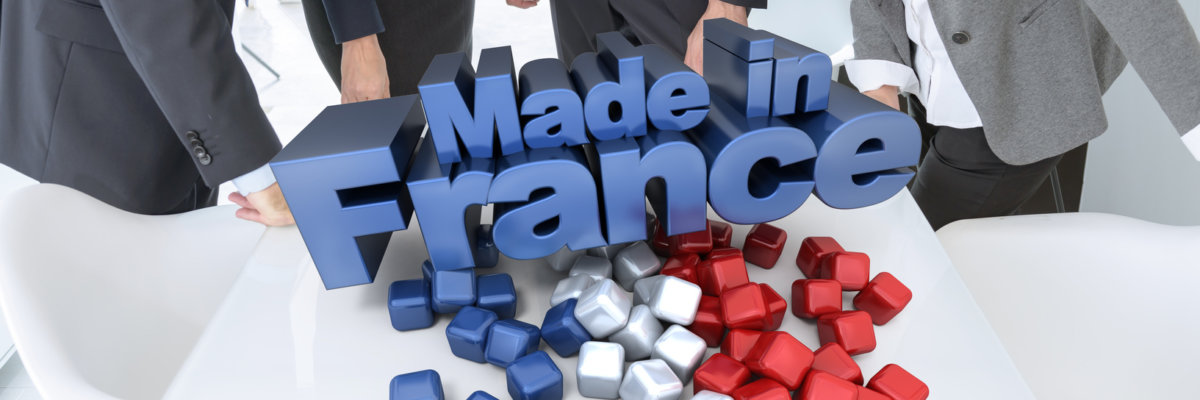 Business people around a table with a made in France 3D sign